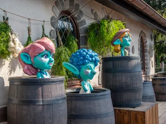 Yomis at Europa-Park Three Yomis in the attraction Josefina's Magical Imperial Journey at Europa-Park peer out from wine barrels.