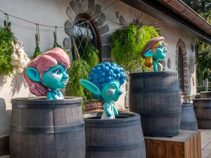 Yomis at Europa-Park Three Yomis in the attraction Josefina's Magical Imperial Journey at Europa-Park peer out from wine barrels.