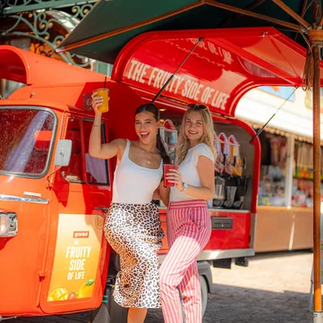 granini drinks cart Two friends are standing in front of the granini drinks cart at Europa-Park.