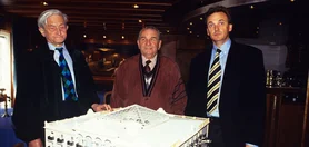Ulrich Damrau, Franz Mack and Jürgen Mack in front of the model of the future hotel 'El Andaluz'.