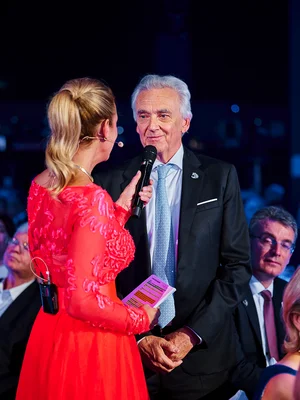 Jürgen Mack is interviewed by presenter Christa Rigozzi at the glittering gala celebrating Europa-Park's 50th anniversary.