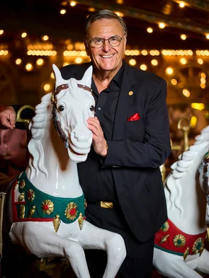 Roland Mack at the Eden Palladium Roland Mack stands next to a wooden horse from the historic Eden Palladium carousel.
