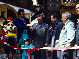 Opening of the Swiss themed area at Europa-Park Roland, Franz and Jürgen Mack, along with Euromaus and guests, cut a red and white ribbon to mark the opening of the Swiss themed area at Europa-Park.