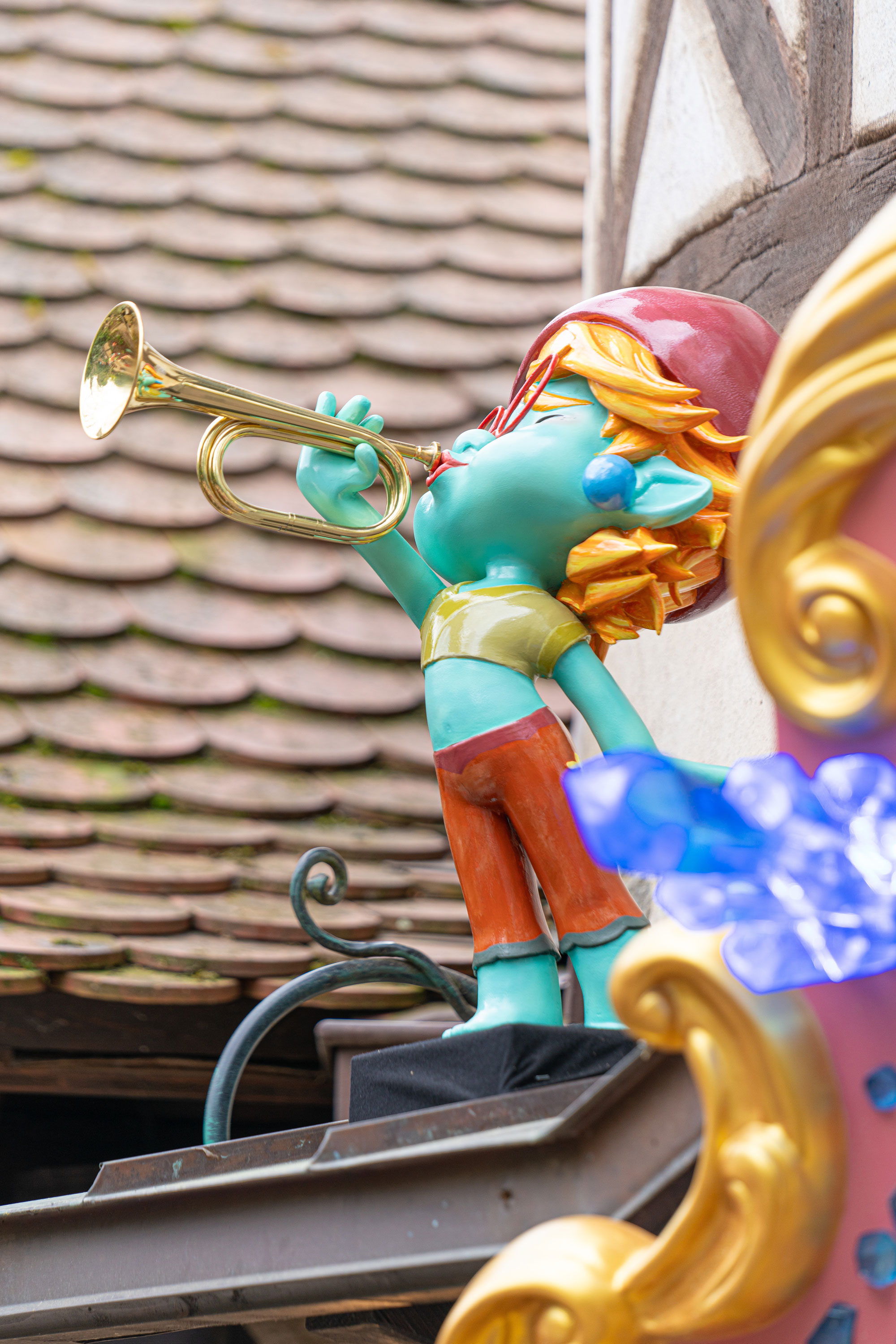 The Yomis A statue of Yomi in the Fairytale Forest at Europa-Park. He is playing a trumpet.