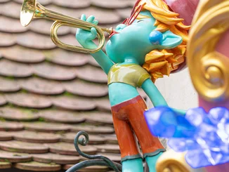 The Yomis A statue of Yomi in the Fairytale Forest at Europa-Park. He is playing a trumpet.