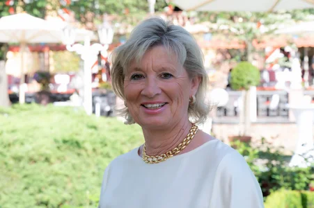 Mauritia Mack Portrait photograph of Mauritia Mack smiling at the camera.