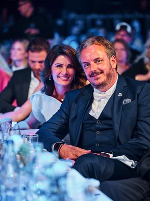 Michael Mack and his wife Miriam Michael Mack next to his wife Miriam at a table at the Europa-Park 50th anniversary gala.