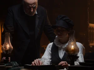Castello dei Medici (Ghost Castle) – short film Scene from the short film Castello dei Medici: A woman sits at a table by candlelight and talks to a man next to her.