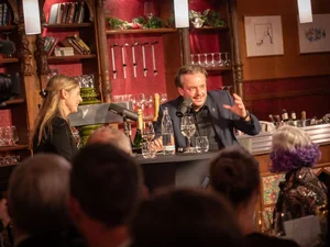 Michael Mack – The World Beyond Michael Mack interviews a guest during a live podcast recording.