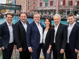 Roland Mack with his family Roland Mack stands in front of the lake at the themed 4* superior hotel ‘Krønasår’ with his children Michael, Thomas and Ann-Kathrin Mack, his brother Jürgen Mack and his son Frederik Mack.