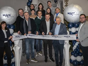 Opening MACK Academy The Mack family stands on the steps of the MACK Academy and cuts a ribbon to mark the opening.