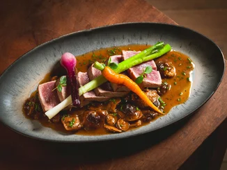 Local specialities at Amitié Close-up of an artfully arranged gourmet course at the Amitié – La Cuisine du Château restaurant.