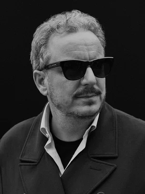 Michael Mack FOCUS STYLE Black and white portrait of Michael Mack wearing sunglasses.