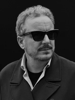 Michael Mack FOCUS STYLE Black and white portrait of Michael Mack wearing sunglasses.