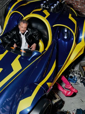 Michael Mack FOCUS STYLE Michael Mack sits in a racing car in the waiting area of the GRAND PRIX EDventure attraction.