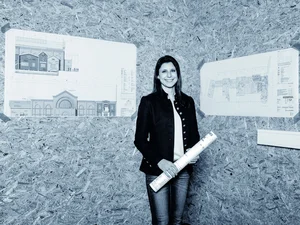 Architect Ann-Kathrin Mack Ann-Kathrin Mack in front of the building plans for the themed 4* superior hotel ‘Krønasår’.
